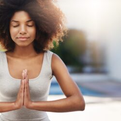 woman meditating at peace living within her means