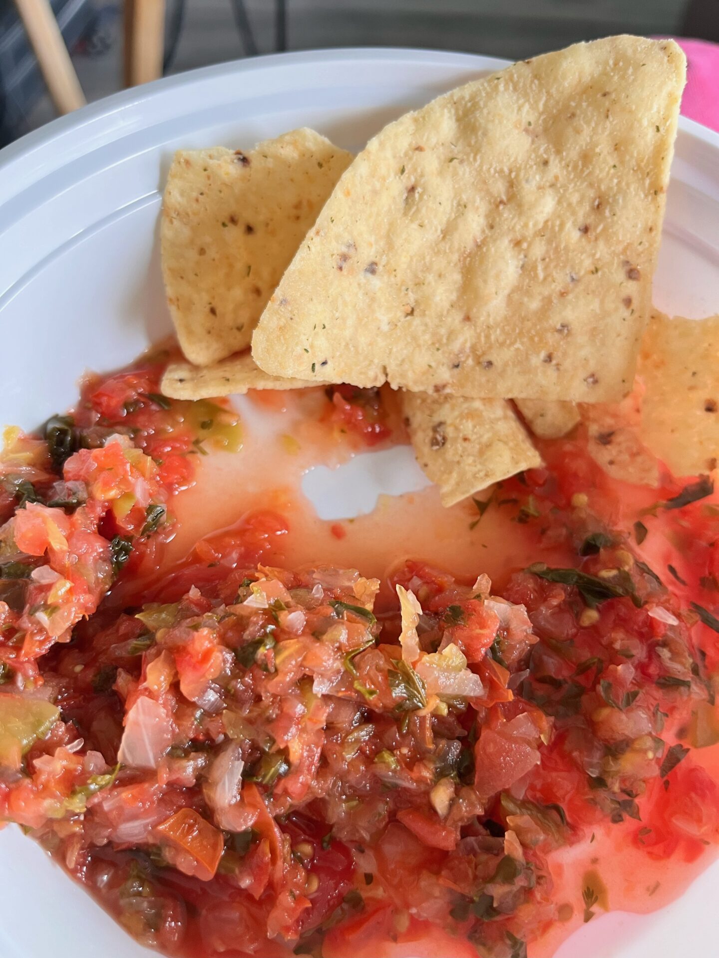 fresh homemade salsa with tortilla chips on a plate